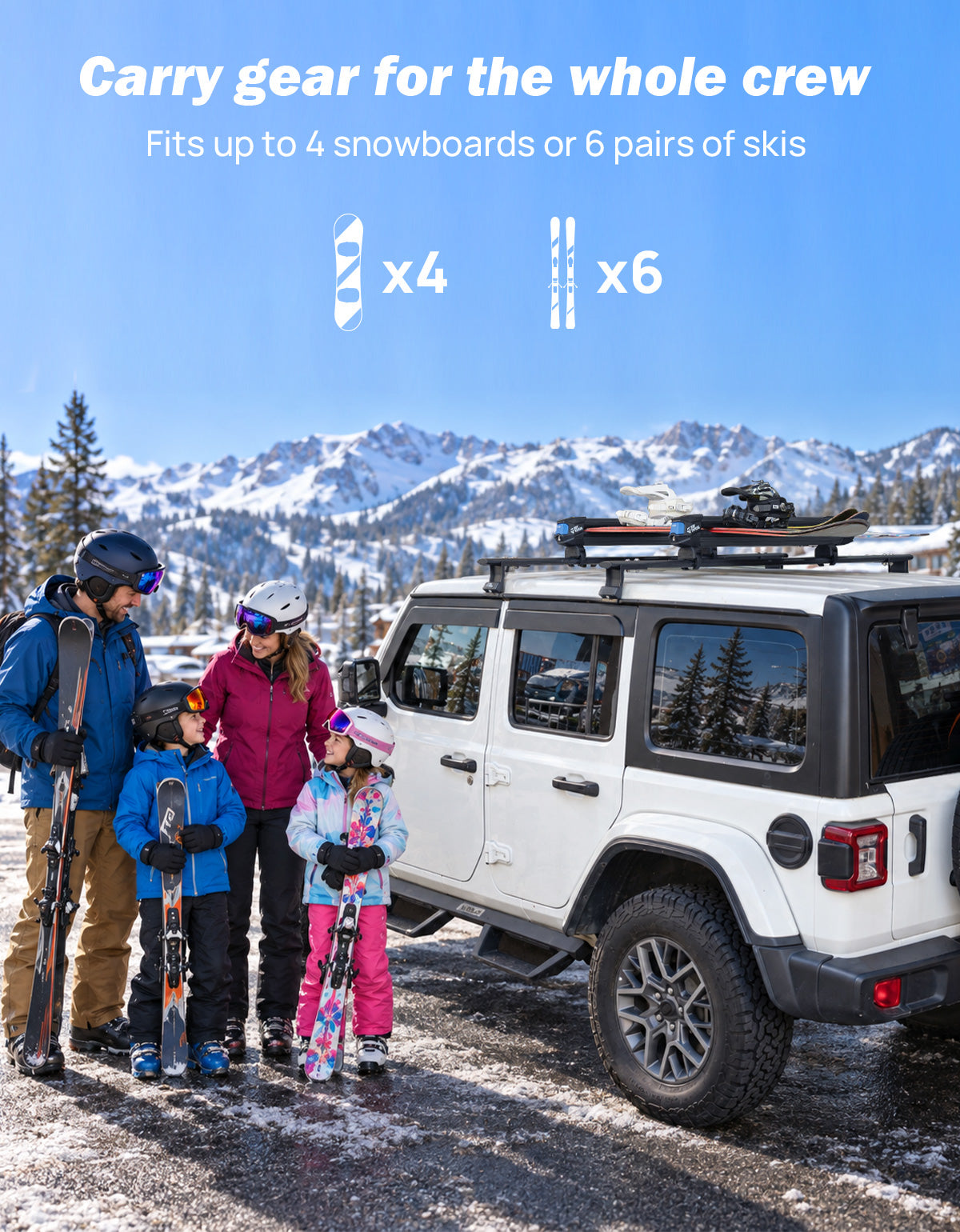 A family of four in ski gear stands beside a white SUV with a roof rack carrying snowboards
