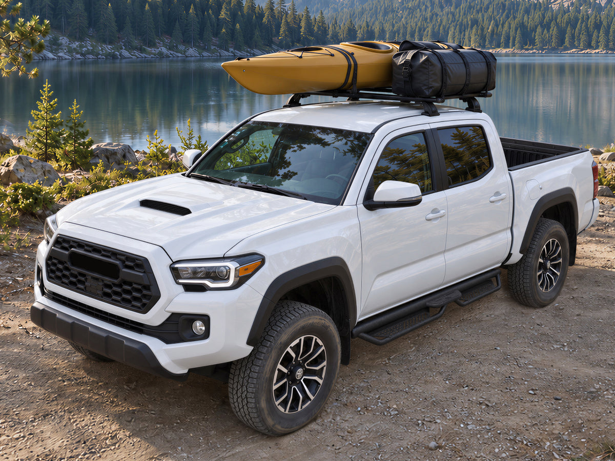 Toyota Tacoma pickup truck with dedicated running boards parked outdoors
